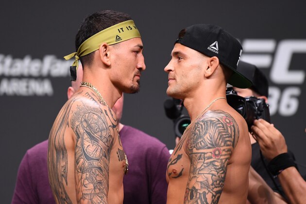 ATLANTA, GA - APRIL 12:  (L-R) Max Holloway and Dustin Poirier face off during the UFC 236 weigh-in at State Farm Arena on April 12, 2019 in Atlanta, Georgia. (Photo by Josh Hedges/Zuffa LLC/Zuffa LLC via Getty Images)