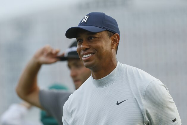 Tiger Woods smiles as he walks off the 18th green during the second round for the Masters golf tournament Friday, April 12, 2019, in Augusta, Ga. (AP Photo/Matt Slocum)