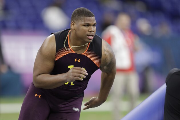 Alabama defensive lineman Quinnen Williams runs a drill during the NFL football scouting combine, Sunday, March 3, 2019, in Indianapolis. (AP Photo/Darron Cummings)