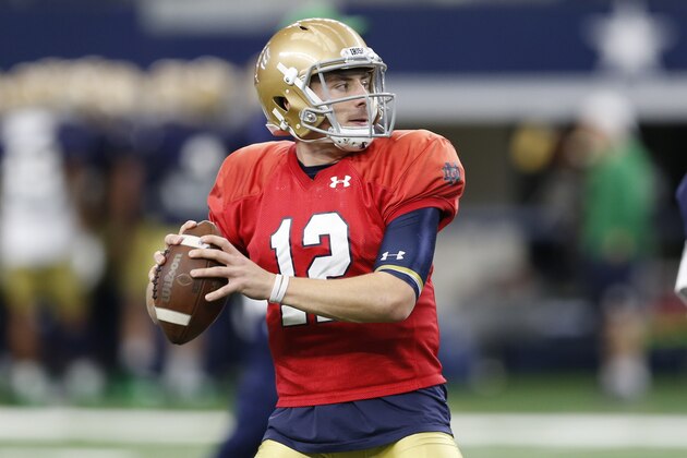 Notre Dame quarterback Ian Book (12) prepares to pass during team practice at AT&T Stadium in Arlington, Texas, Monday, Dec. 24, 2018. Notre Dame is scheduled to play Clemson in the NCAA Cotton Bowl semi-final playoff Saturday. (AP Photo/Jim Cowsert)