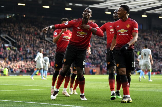 MANCHESTER, ENGLAND - APRIL 13: Paul Pogba of Manchester United celebrates as he scores his team's first goal from the penalty spot with Anthony Martial and team mates during the Premier League match between Manchester United and West Ham United at Old Trafford on April 13, 2019 in Manchester, United Kingdom. (Photo by Gareth Copley/Getty Images)