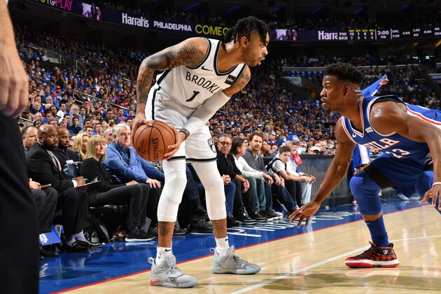 PHILADELPHIA, PA - APRIL 13: D'Angelo Russell #1 of the Brooklyn Nets handles the ball against Jimmy Butler #23 of the Philadelphia 76ers during Game One of Round One of the 2019 NBA Playoffs on April 13, 2019 at the Wells Fargo Center in Philadelphia, Pennsylvania NOTE TO USER: User expressly acknowledges and agrees that, by downloading and/or using this Photograph, user is consenting to the terms and conditions of the Getty Images License Agreement. Mandatory Copyright Notice: Copyright 2019 NBAE (Photo by Jesse D. Garrabrant/NBAE via Getty Images)