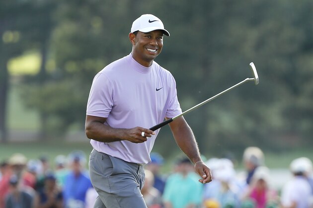 AUGUSTA, GEORGIA - APRIL 13: Tiger Woods of the United States smiles as he walks on the 18th hole during the third round of the Masters at Augusta National Golf Club on April 13, 2019 in Augusta, Georgia. (Photo by Kevin C. Cox/Getty Images)