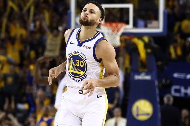 OAKLAND, CALIFORNIA - APRIL 13:   Stephen Curry #30 of the Golden State Warriors reacts after making a basket against the LA Clippers during Game One of the first round of the 2019 NBA Western Conference Playoffs at ORACLE Arena on April 13, 2019 in Oakland, California. NOTE TO USER: User expressly acknowledges and agrees that, by downloading and or using this photograph, User is consenting to the terms and conditions of the Getty Images License Agreement. (Photo by Ezra Shaw/Getty Images)