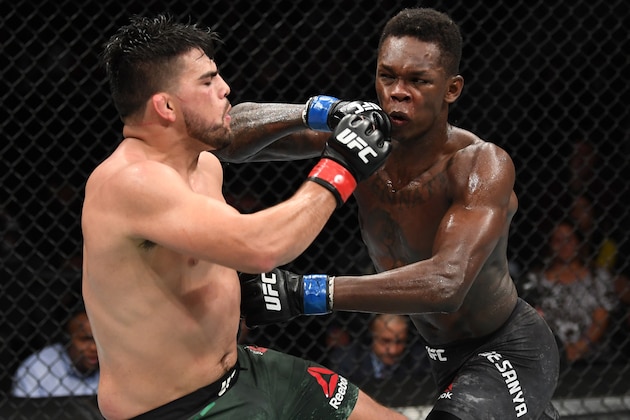 ATLANTA, GA - APRIL 13:  (L-R) Kelvin Gastelum and Israel Adesanya exchange strikes in their interim middleweight championship bout during the UFC 236 event at State Farm Arena on April 13, 2019 in Atlanta, Georgia. (Photo by Josh Hedges/Zuffa LLC/Zuffa LLC via Getty Images)