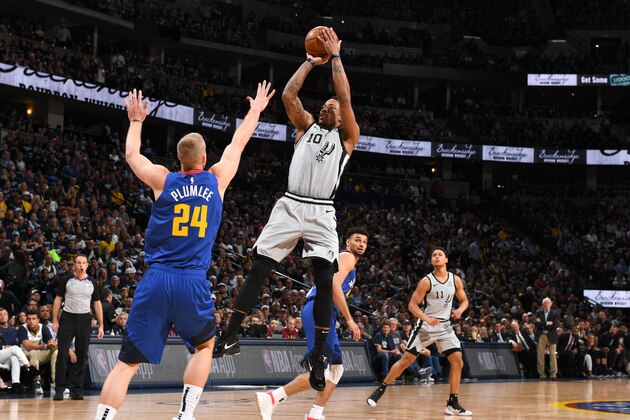DENVER, CO - APRIL 13: DeMar DeRozan #10 of the San Antonio Spurs shoots the ball against the Denver Nuggets during Game One of Round One of the 2019 NBA Playoffs on April 13, 2019 at the Pepsi Center in Denver, Colorado. NOTE TO USER: User expressly acknowledges and agrees that, by downloading and/or using this photograph, user is consenting to the terms and conditions of the Getty Images License Agreement. Mandatory Copyright Notice: Copyright 2019 NBAE (Photo by Garrett Ellwood/NBAE via Getty Images)