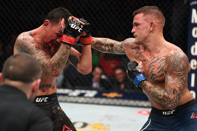 ATLANTA, GA - APRIL 13:  (R-L) Dustin Poirier punches Max Holloway in their interim lightweight championship bout during the UFC 236 event at State Farm Arena on April 13, 2019 in Atlanta, Georgia. (Photo by Josh Hedges/Zuffa LLC/Zuffa LLC via Getty Images)