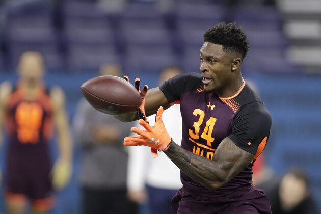 Mississippi wide receiver D.K. Metcalf runs a drill during the NFL football scouting combine, Saturday, March 2, 2019, in Indianapolis. (AP Photo/Darron Cummings)