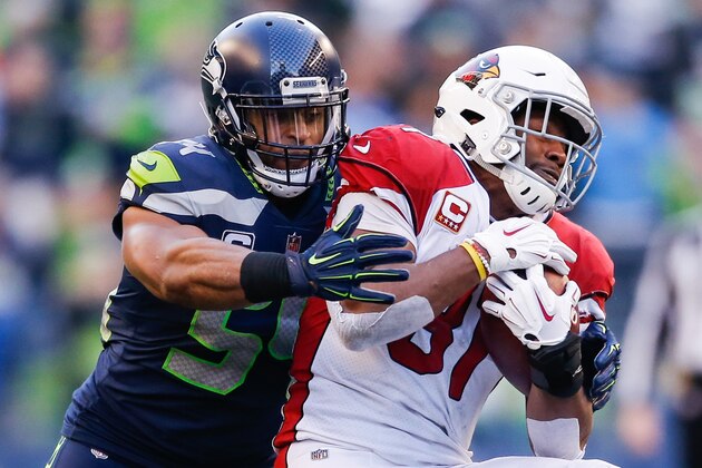 SEATTLE, WA - DECEMBER 30: Bobby Wagner #54 of the Seattle Seahawks tackles David Johnson #31 of the Arizona Cardinals in the third quarter at CenturyLink Field on December 30, 2018 in Seattle, Washington. (Photo by Otto Greule Jr/Getty Images)