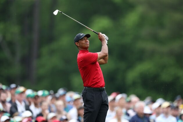 AUGUSTA, GEORGIA - APRIL 14: Tiger Woods of the United States plays a shot from the 12th tee during the final round of the Masters at Augusta National Golf Club on April 14, 2019 in Augusta, Georgia. (Photo by David Cannon/Getty Images)