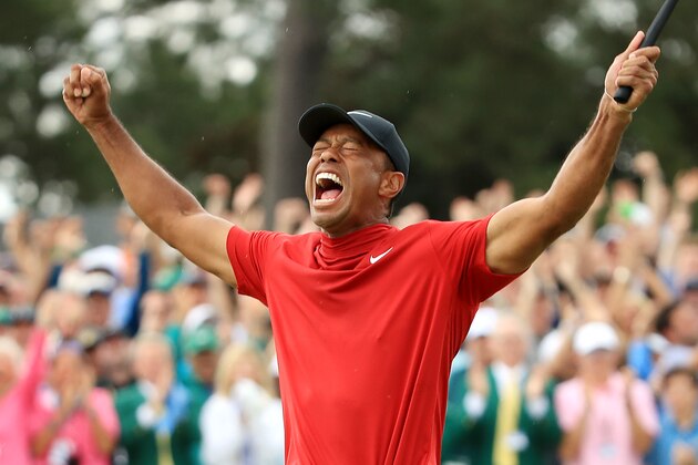 AUGUSTA, GEORGIA - APRIL 14: Tiger Woods of the United States celebrates after sinking his putt on the 18th green to win during the final round of the Masters at Augusta National Golf Club on April 14, 2019 in Augusta, Georgia. (Photo by Andrew Redington/Getty Images)