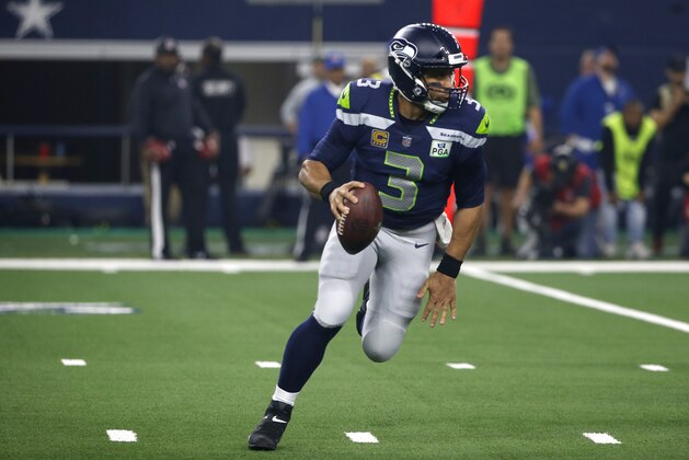 Seattle Seahawks quarterback Russell Wilson (3) scrambles out of the pocket during an NFC wild-card NFL football game against the Dallas Cowboys in Arlington, Texas, Saturday, Jan. 5, 2019.(AP Photo/Ron Jenkins)