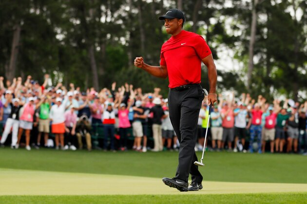 AUGUSTA, GEORGIA - APRIL 14: Tiger Woods of the United States celebrates after sinking his putt on the 18th green to win during the final round of the Masters at Augusta National Golf Club on April 14, 2019 in Augusta, Georgia. (Photo by Kevin C. Cox/Getty Images)