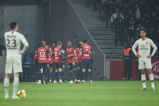 Lille's Ivorian forward Nicolas Pepe (C) is congratulated by teammates after scoring a goal during the French L1 football match between Lille (LOSC) and Paris Saint-Germain (PSG) on April 14, 2019, at the Pierre-Mauroy Stadium in Villeneuve d'Ascq, near Lille, northern France. (Photo by FRANCOIS LO PRESTI / AFP)        (Photo credit should read FRANCOIS LO PRESTI/AFP/Getty Images)