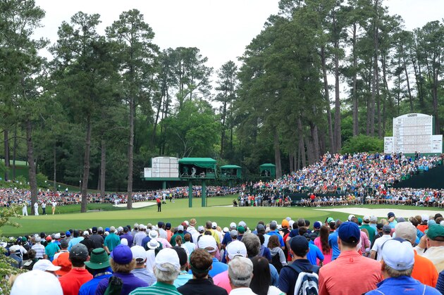 AUGUSTA, GEORGIA - APRIL 14: Patrons watch as Tiger Woods of the United States putts on the 15th green during the final round of the Masters at Augusta National Golf Club on April 14, 2019 in Augusta, Georgia. (Photo by David Cannon/Getty Images)