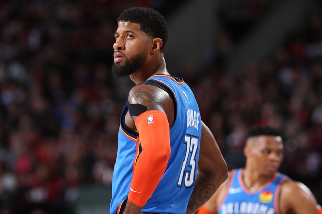 PORTLAND, OR - APRIL 14:  Paul George #13 of the Oklahoma City Thunder looks on against the Portland Trail Blazers during Game One of Round One of the 2019 NBA Playoffs on April 14, 2019 at the Moda Center Arena in Portland, Oregon. NOTE TO USER: User expressly acknowledges and agrees that, by downloading and or using this photograph, user is consenting to the terms and conditions of the Getty Images License Agreement. Mandatory Copyright Notice: Copyright 2019 NBAE (Photo by Sam Forencich/NBAE via Getty Images)