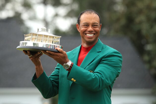 AUGUSTA, GEORGIA - APRIL 14: Tiger Woods of the United States celebrates with the Masters Trophy during the Green Jacket Ceremony after winning the Masters at Augusta National Golf Club on April 14, 2019 in Augusta, Georgia. (Photo by Andrew Redington/Getty Images)