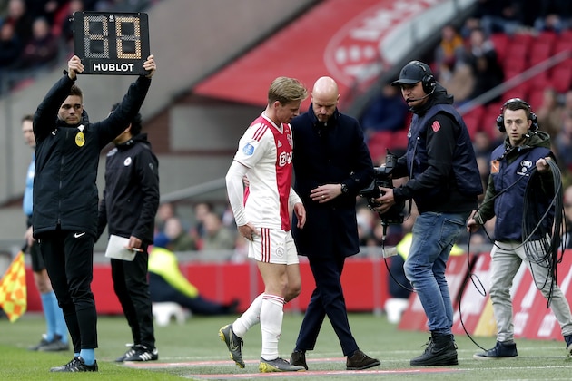 AMSTERDAM, NETHERLANDS - APRIL 13: (L-R) Frenkie de Jong of Ajax, coach Erik ten Hag of Ajax  during the Dutch Eredivisie  match between Ajax v Excelsior at the Johan Cruijff Arena on April 13, 2019 in Amsterdam Netherlands (Photo by Rico Brouwer/Soccrates/Getty Images)