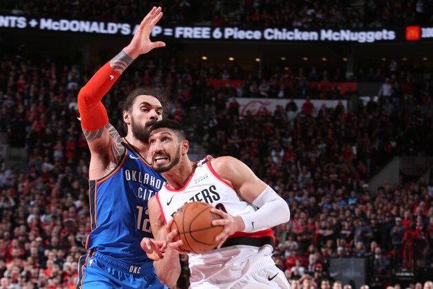 PORTLAND, OR - APRIL 14:  Enes Kanter #00 of the Portland Trail Blazers drives to the basket against the Oklahoma City Thunder during Game One of Round One of the 2019 NBA Playoffs on April 14, 2019 at the Moda Center Arena in Portland, Oregon. NOTE TO USER: User expressly acknowledges and agrees that, by downloading and or using this photograph, user is consenting to the terms and conditions of the Getty Images License Agreement. Mandatory Copyright Notice: Copyright 2019 NBAE (Photo by Sam Forencich/NBAE via Getty Images)