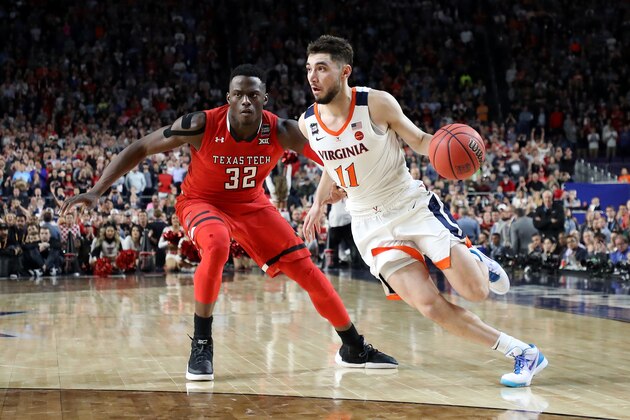 MINNEAPOLIS, MINNESOTA - APRIL 08:  Ty Jerome #11 of the Virginia Cavaliers is defended by Norense Odiase #32 of the Texas Tech Red Raiders in the second half during the 2019 NCAA men's Final Four National Championship game at U.S. Bank Stadium on April 08, 2019 in Minneapolis, Minnesota. (Photo by Streeter Lecka/Getty Images)