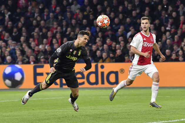Juventus' Cristiano Ronaldo scores his side's opening goal during the Champions League quarterfinal, first leg, soccer match between Ajax and Juventus at the Johan Cruyff ArenA in Amsterdam, Netherlands, Wednesday, April 10, 2019. (AP Photo/Martin Meissner)