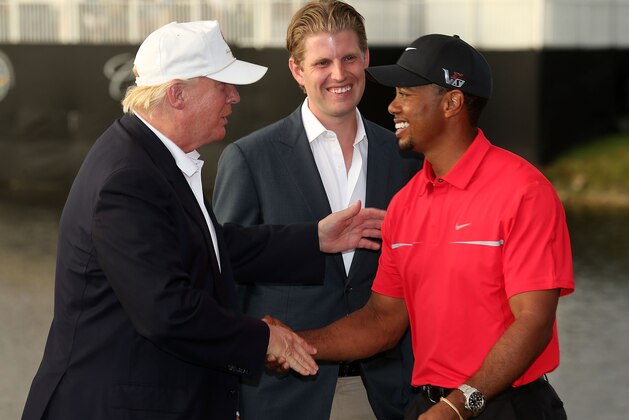 DORAL, FL - MARCH 10:  Developer Donald Trump (L) greets Tiger Woods after the final round of the World Golf Championships-Cadillac Championship as Eric Trump looks on at the Trump Doral Golf Resort & Spa on March 10, 2013 in Doral, Florida.  (Photo by Warren Little/Getty Images)