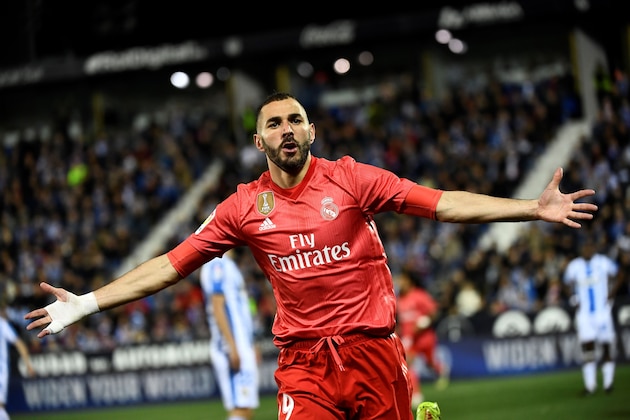 Real Madrid's French forward Karim Benzema celebrates after scoring during the Spanish league football match between Club Deportivo Leganes SAD and Real Madrid CF at the Estadio Municipal Butarque in Leganes on April 15, 2019. (Photo by PIERRE-PHILIPPE MARCOU / AFP)        (Photo credit should read PIERRE-PHILIPPE MARCOU/AFP/Getty Images)