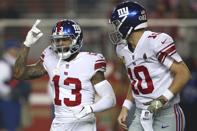 New York Giants wide receiver Odell Beckham Jr. (13) and quarterback Eli Manning (10) celebrate after connecting on a touchdown pass against the San Francisco 49ers during the second half of an NFL football game in Santa Clara, Calif., Monday, Nov. 12, 2018. (AP Photo/Ben Margot)
