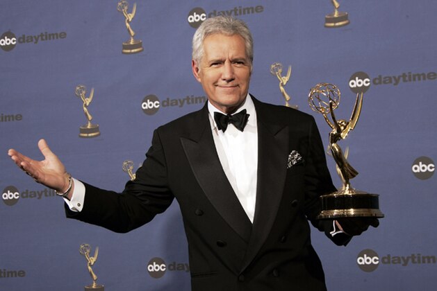 FILE - In this Friday, April 28, 2006, file photo, Alex Trebek holds the award for outstanding game show host, for his work on