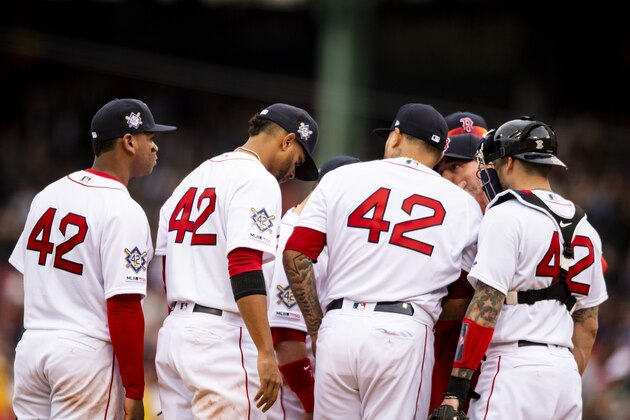 BOSTON, MA - APRIL 15: Members of the Boston Red Sox display the number 42 in recognition of Jackie Robinson Day during a game against the Baltimore Orioles on April 15, 2019 at Fenway Park in Boston, Massachusetts.All players are wearing the number 42 in honor of Jackie Robinson Day.  (Photo by Billie Weiss/Boston Red Sox/Getty Images)