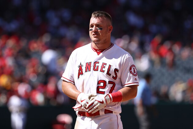 ANAHEIM, CALIFORNIA - APRIL 07: Mike Trout #27 of the Los Angeles Angels of Anaheim talks to Elvis Andrus #1 of the Texas Rangers after the fourth inning of the MLB game at Angel Stadium of Anaheim on April 07, 2019 in Anaheim, California. The Angels defeated the Rangers 7-2. (Photo by Victor Decolongon/Getty Images)