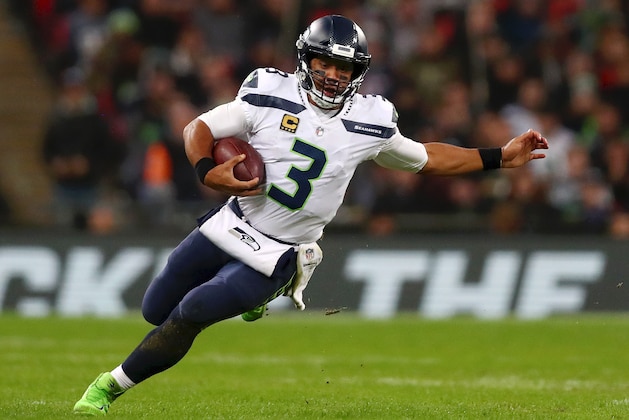 LONDON, ENGLAND - OCTOBER 14:  Russell Wilson of Seattle Seahawks in action during the NFL International series match between Seattle Seahawks and Oakland Raiders at Wembley Stadium on October 14, 2018 in London, England.  (Photo by Naomi Baker/Getty Images)