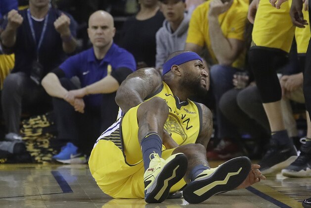 Golden State Warriors center DeMarcus Cousins reacts after falling to the floor during the first half of Game 2 of a first-round NBA basketball playoff series against the Los Angeles Clippers in Oakland, Calif., Monday, April 15, 2019. (AP Photo/Jeff Chiu)