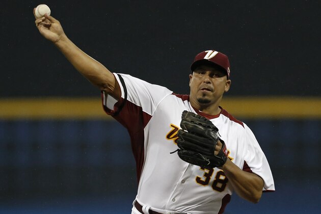 Venezuela starting pitcher Carlos Zambrano throws in the first inning of the World Baseball Classic first round game against Puerto Rico in San Juan, Puerto Rico, Saturday, March 9, 2013. (AP Photo/Andres Leighton)