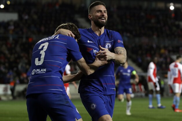 Chelsea's Olivier Giroud, right, celebrates after teammate Marcos Alonso, left, scored his side's first goal of the game during the UEFA Europa League quarterfinal soccer match between Slavia Prague and Chelsea at the Sinobo stadium in Prague, Czech Republic, Thursday, April 11, 2019. (AP Photo/Petr David Josek)