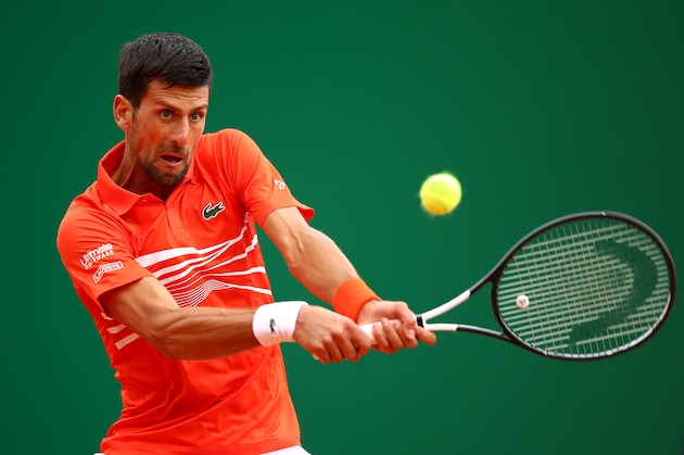 MONTE-CARLO, MONACO - APRIL 16: Novak Djokovic of Serbia plays a backhand against Philipp Kohlschreiber of Germany in their second round match during day 3 of the Rolex Monte-Carlo Masters at Monte-Carlo Country Club on April 16, 2019 in Monte-Carlo, Monaco. (Photo by Clive Brunskill/Getty Images)