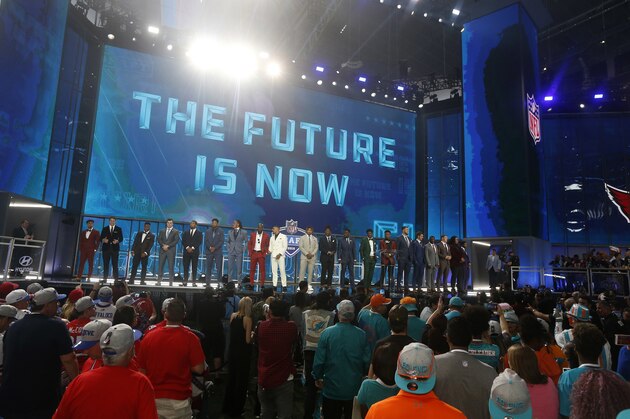 Prospects in attendance stand on stage at the start of the first round of the NFL football draft, Thursday, April 26, 2018, in Arlington, Texas. (AP Photo/Michael Ainsworth)