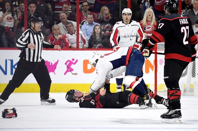 RALEIGH, NORTH CAROLINA - APRIL 15: Alex Ovechkin #8 of the Washington Capitals knocks out Andrei Svechnikov #37 of the Carolina Hurricanes as they fight during the first period in Game Three of the Eastern Conference First Round during the 2019 NHL Stanley Cup Playoffs at PNC Arena on April 15, 2019 in Raleigh, North Carolina. (Photo by Grant Halverson/Getty Images)