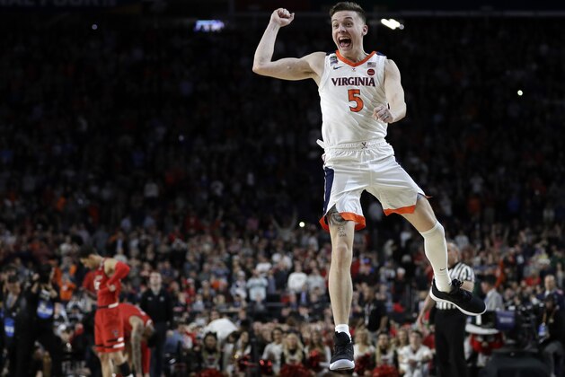 Virginia's Kyle Guy (5) celebrates after defeating Texas Tech 85-77 in the overtime in the championship of the Final Four NCAA college basketball tournament, Monday, April 8, 2019, in Minneapolis. (AP Photo/David J. Phillip)