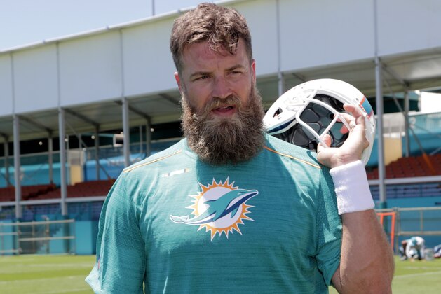 Miami Dolphins quarterback Ryan Fitzpatrick walks off the field during voluntary minicamp at the Miami Dolphins football training facility, Tuesday, April 16, 2019, in Davie, Fla. (AP Photo/Lynne Sladky)