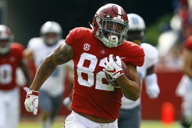 Alabama tight end Irv Smith Jr. (82) carries the ball in for a touchdown against Citadel during the second half of an NCAA college football game, Saturday, Nov. 17, 2018, in Tuscaloosa, Ala. (AP Photo/Butch Dill)