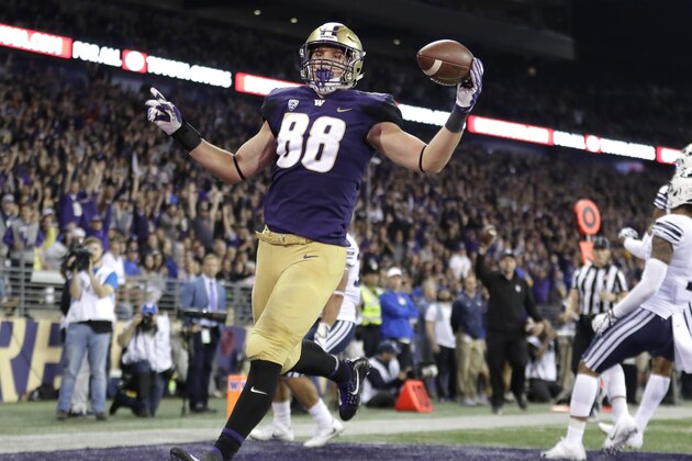 Washington tight end Drew Sample, left, runs for a touchdown after a pass reception against BYU during the second half of an NCAA college football game, Saturday, Sept. 29, 2018, in Seattle. (AP Photo/Ted S. Warren)