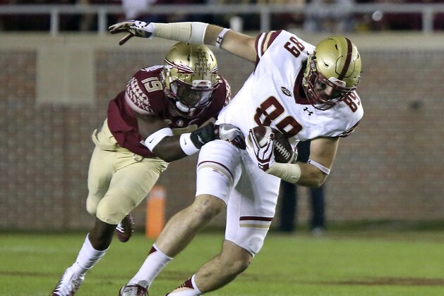 Boston College's Tommy Sweeney is tackled by Florida State's A.J. Westbrook after making a reception in the first half of an NCAA college football game Friday, Nov. 11, 2016, in Tallahassee, Fla. (AP Photo/Steve Cannon)