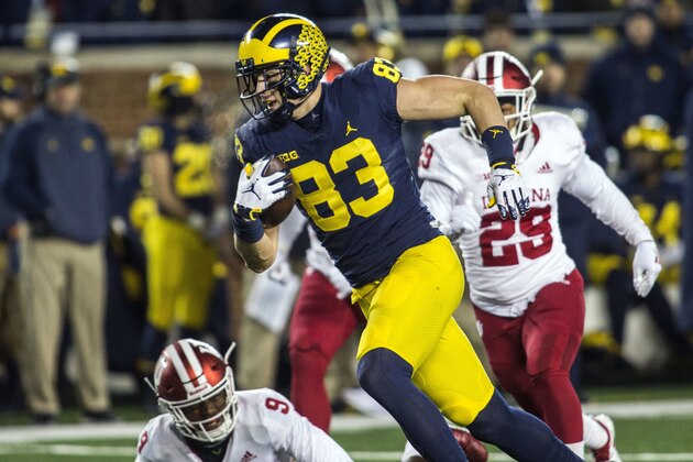 Michigan tight end Zach Gentry (83) rushes past Indiana defensive back Jonathan Crawford (9) after making a 42-yard reception in the second quarter of an NCAA college football game in Ann Arbor, Mich., Saturday, Nov. 17, 2018. (AP Photo/Tony Ding)