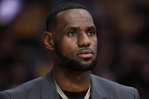 Los Angeles Lakers' LeBron James wears a T-shirt with the likeness of slain rapper Nipsey Hussle during the first half of the team's NBA basketball game against the Golden State Warriors on Thursday, April 4, 2019, in Los Angeles. (AP Photo/Marcio Jose Sanchez)
