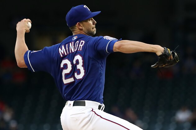 ARLINGTON, TEXAS - APRIL 16:  Mike Minor #23 of the Texas Rangers throws against the Los Angeles Angels in the first inning at Globe Life Park in Arlington on April 16, 2019 in Arlington, Texas. (Photo by Ronald Martinez/Getty Images)