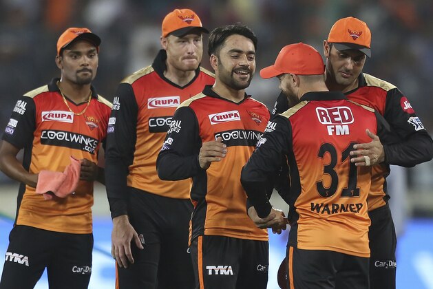 Sunrisers Hyderabad's David Warner greets Mohammed Nabi, right, after winning match against Royal Challengers Banglores during the VIVO IPL T20 cricket match in Hyderabad, India, Sunday, March 31, 2019. (AP Photo/ Mahesh Kumar A.)