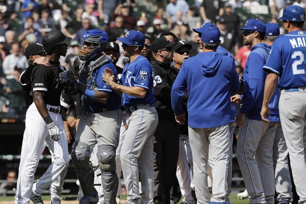 Chicago White Sox's Tim Anderson, left, talks to Kansas City Royals catcher Martin Maldonado after being hit by a pitch during the sixth inning of a baseball game in Chicago, Wednesday, April 17, 2019. (AP Photo/Nam Y. Huh)