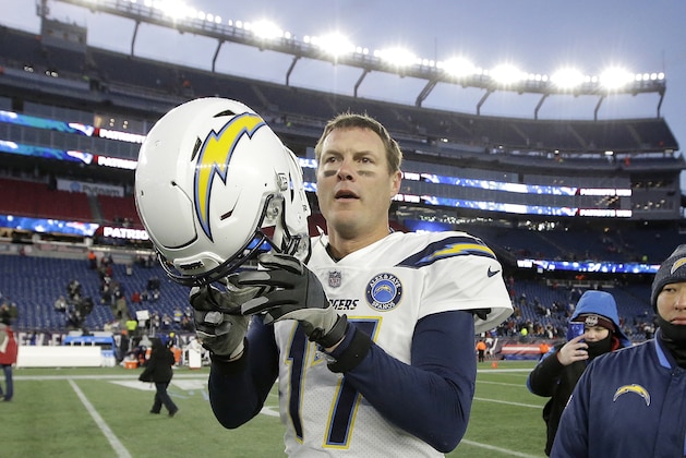 FILE - In this Sunday, Jan. 13, 2019, file photo,  Los Angeles Chargers quarterback Philip Rivers leaves the field after an NFL divisional playoff football game against the New England Patriots in Foxborough, Mass. Rivers fought back tears as he accepted an award from the San Diego Sports Association at its annual Salute to the Champions dinner Thursday, Jan. 31, 2019. (AP Photo/Steven Senne, File)