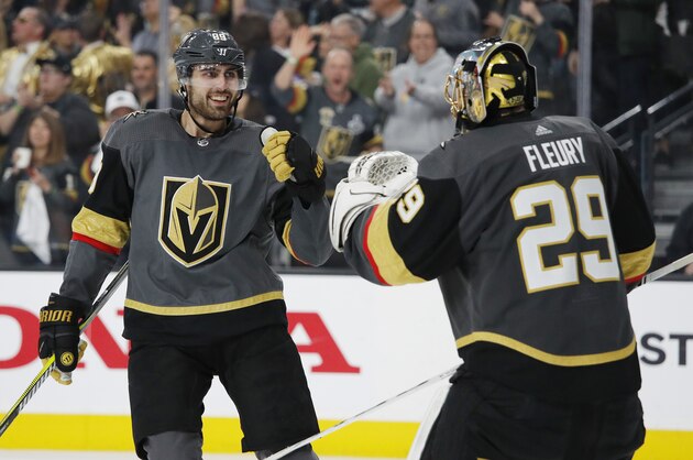 Vegas Golden Knights right wing Alex Tuch, left, celebrates with goalie Marc-Andre Fleury after scoring against the San Jose Sharks during the third period of Game 4 of a first-round NHL hockey playoff series Tuesday, April 16, 2019, in Las Vegas. (AP Photo/John Locher)